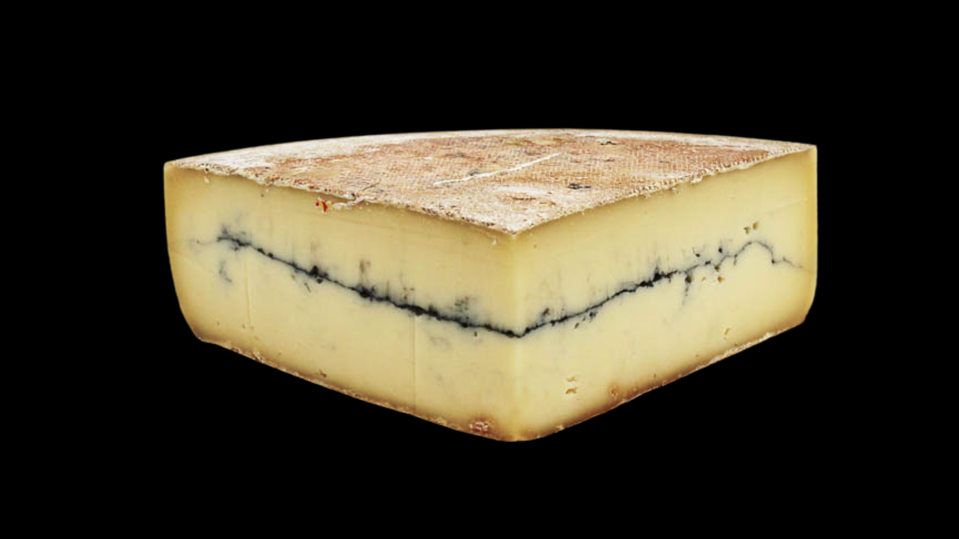 Se muestra una cuña de queso con una linea de ceniza azul en medio.